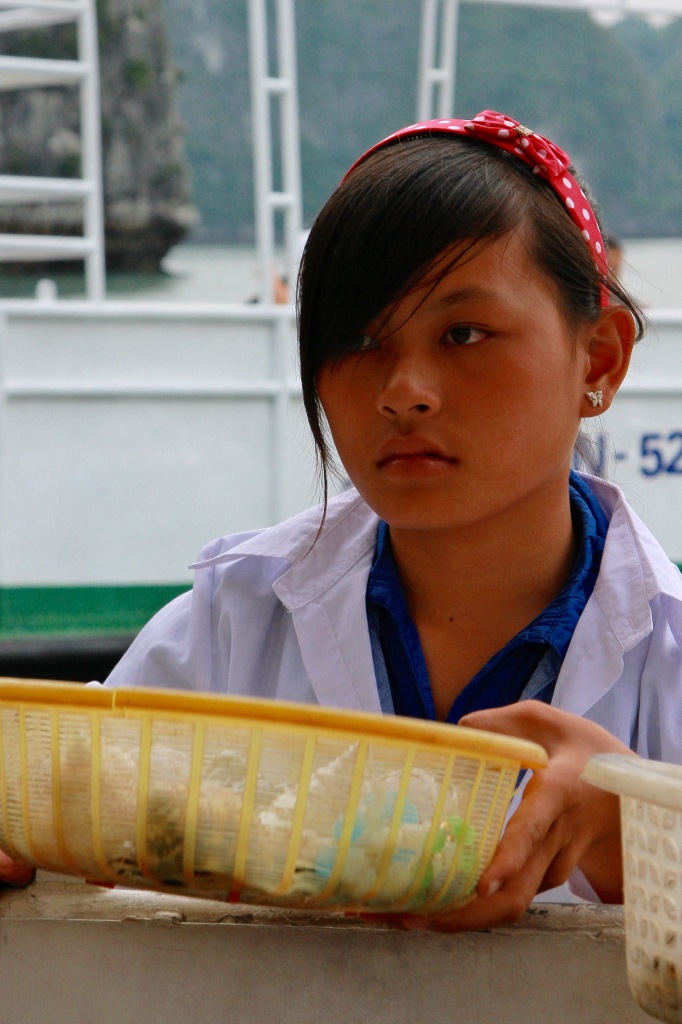 Girl selling Halong beach Vietnam 